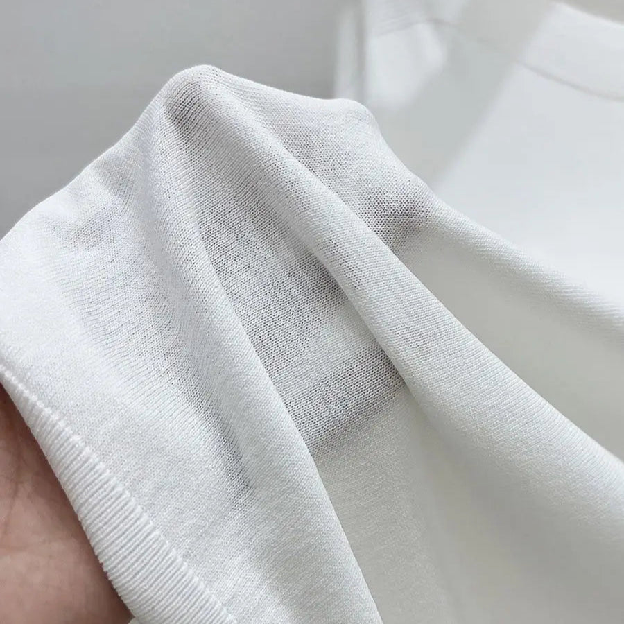Dame T-skjorte i Ice Silk – Lett og Løs Strikket Sommertopp med Rund Hals